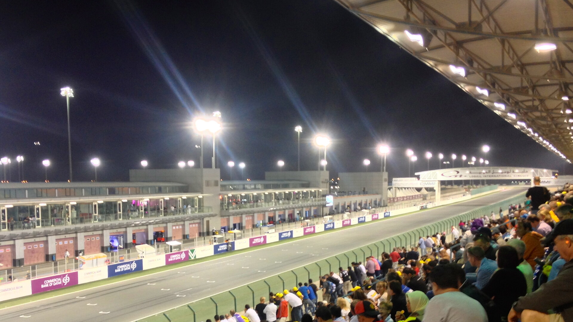 Spectators in Lusail International Circuit's main grandstand during a night race